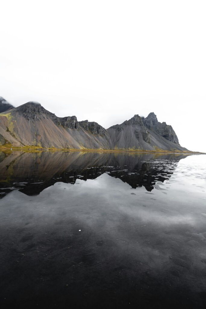 A mountain reflected in a lake or the sea